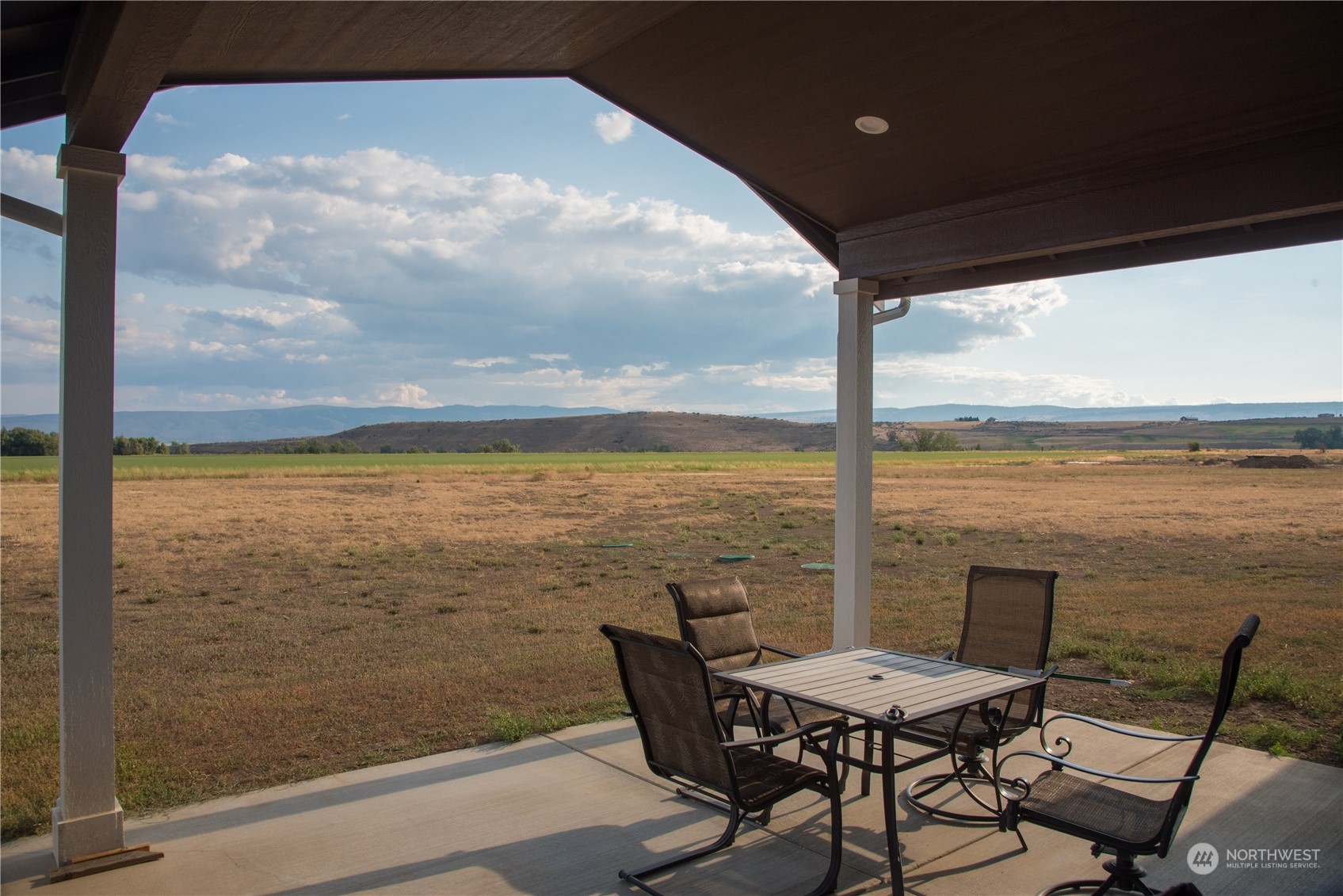 570 Green Canyon Road Ellensburg, WA 98926 - Photo 29 of 34 a view of a balcony with table and chairs