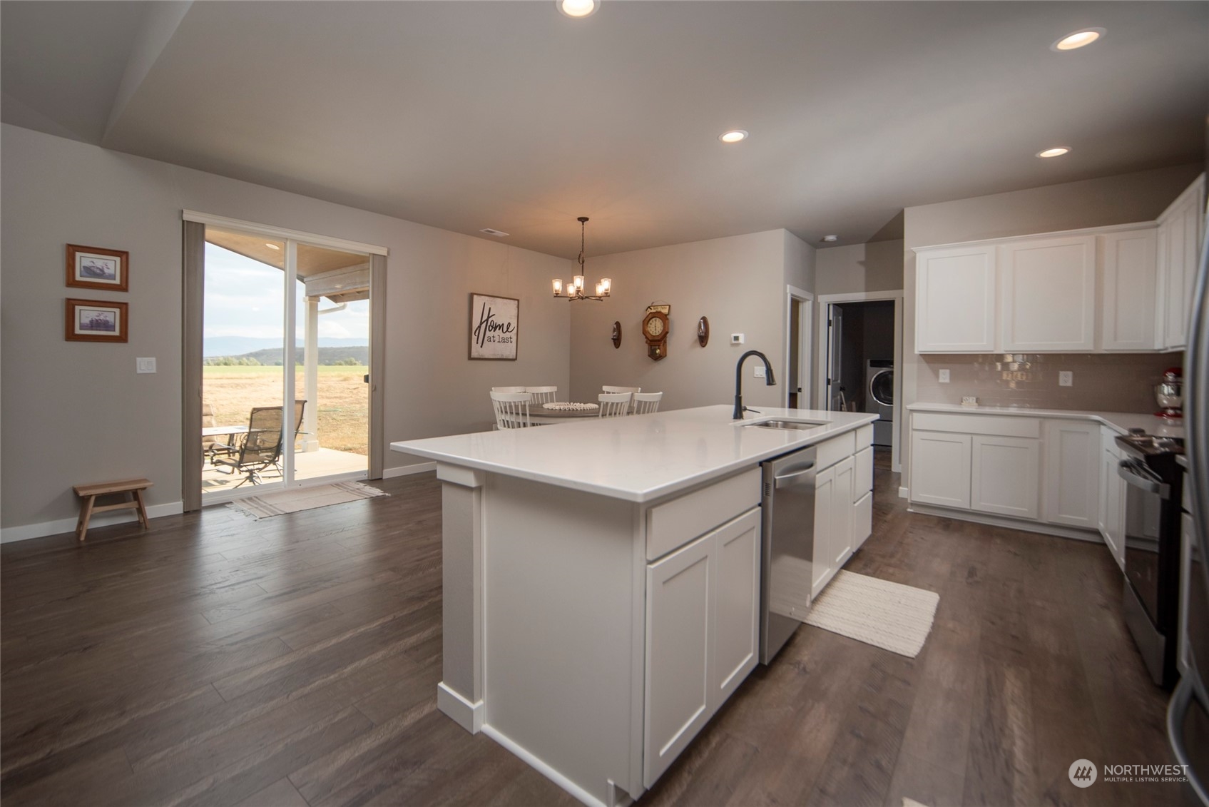 570 Green Canyon Road Ellensburg, WA 98926 - Photo 7 of 34 a kitchen with a sink microwave and cabinets