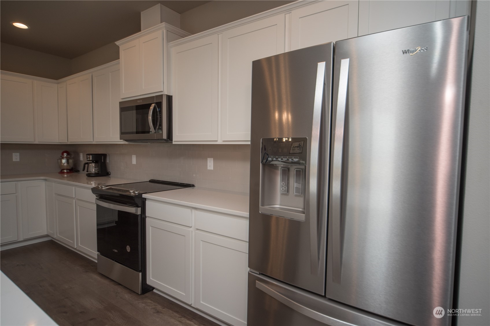 570 Green Canyon Road Ellensburg, WA 98926 - Photo 10 of 34 a kitchen with stainless steel appliances a refrigerator sink and cabinets