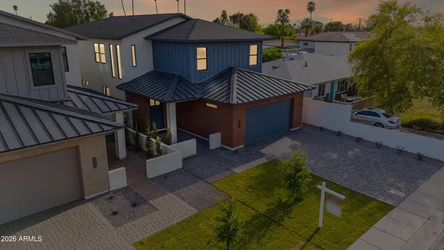 a aerial view of a house with a swimming pool and a yard