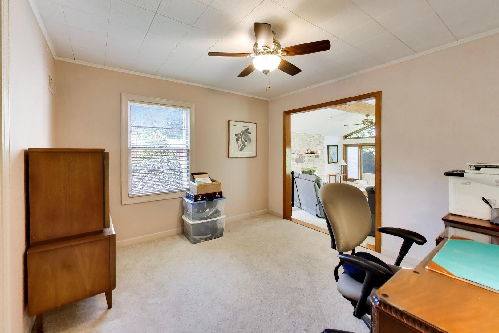 103 Cottonwood Road Northbrook, IL 60062 - Photo 19 of 50 a view of a workspace with furniture and a window