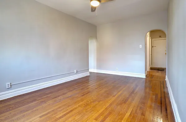 a view of room with wooden floor