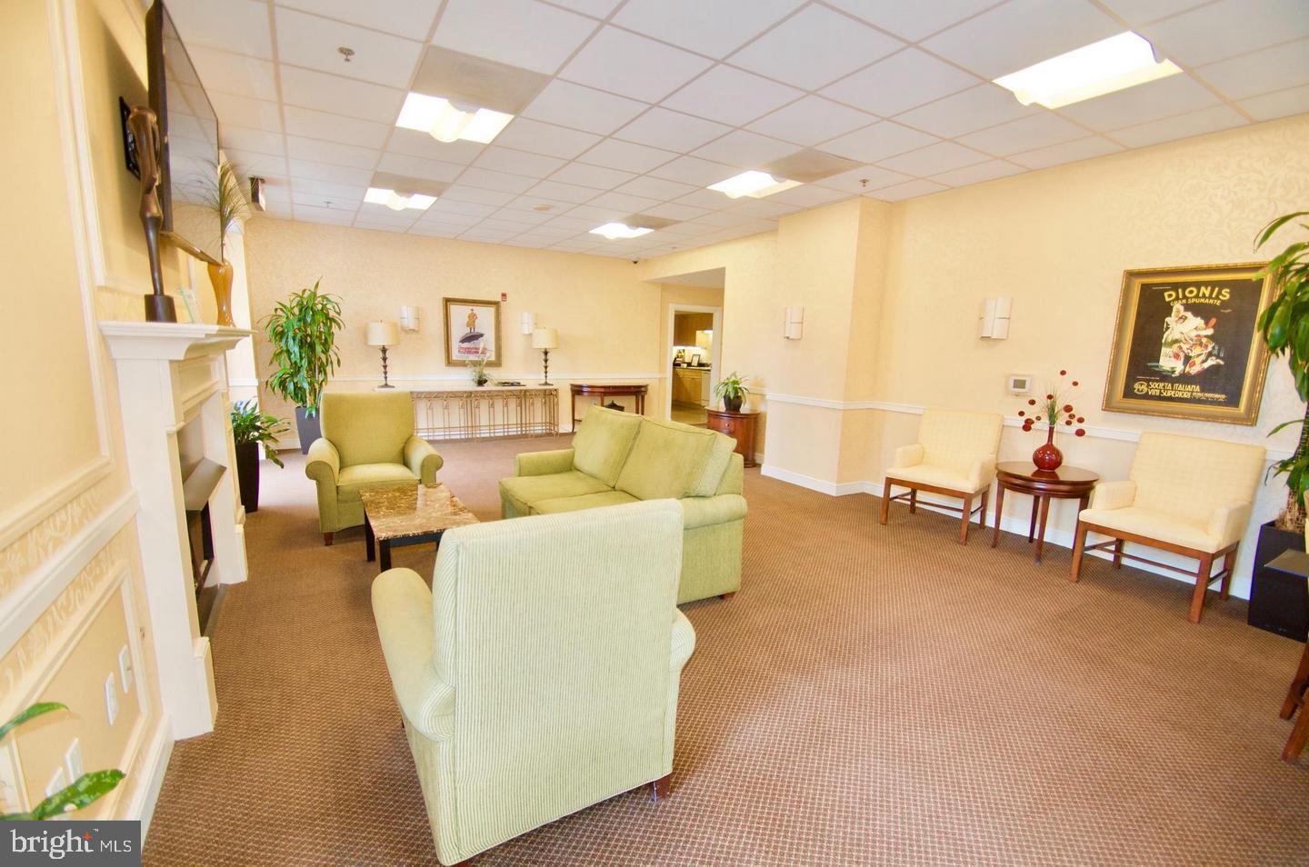 2726 Gallows Road, Unit 917 Vienna, VA 22180 - Photo 17 of 25 a living room with furniture and a table