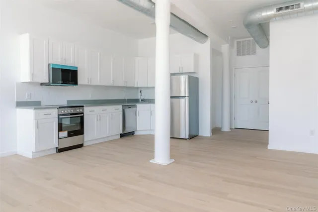 a view of a kitchen with a sink