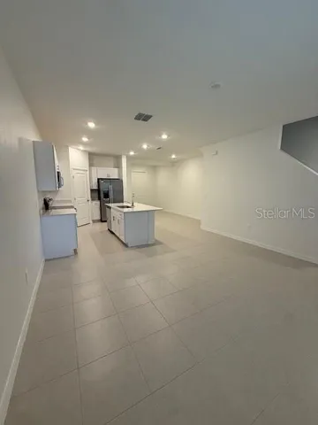 a large kitchen with cabinets