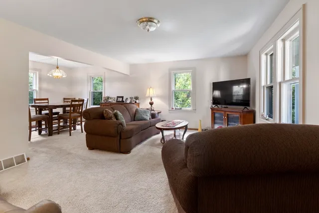 a view of a dining room with furniture window and outside view