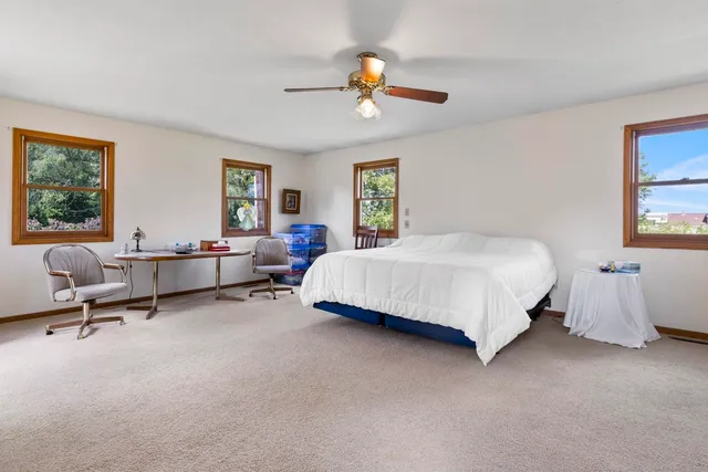 a bedroom with a bed and window