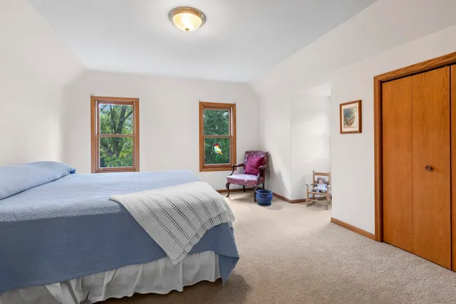 a bedroom with a bed and closet