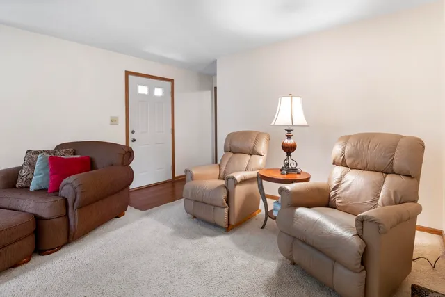 a living room with furniture or couch and a window