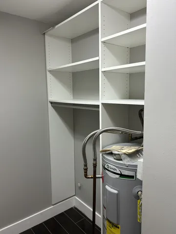 a bathroom with a shower toilet and sink