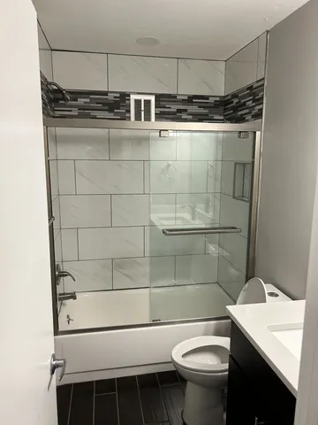 a bathroom with a sink and toilet