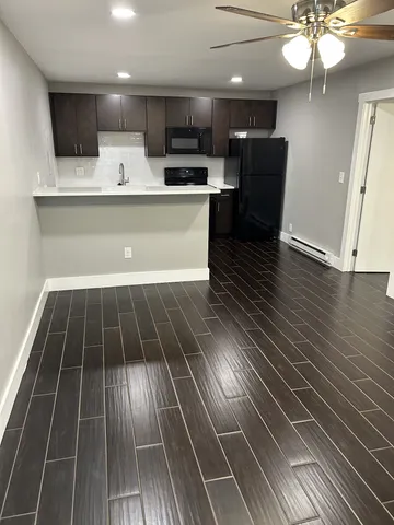 a view of kitchen with cabinets