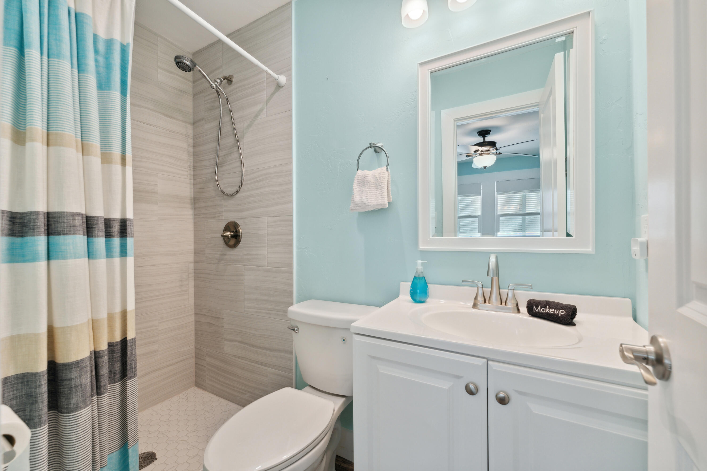 129 Durango Road, Unit 1 Destin, FL 32541 - Photo 11 of 71 a bathroom with a sink toilet and shower