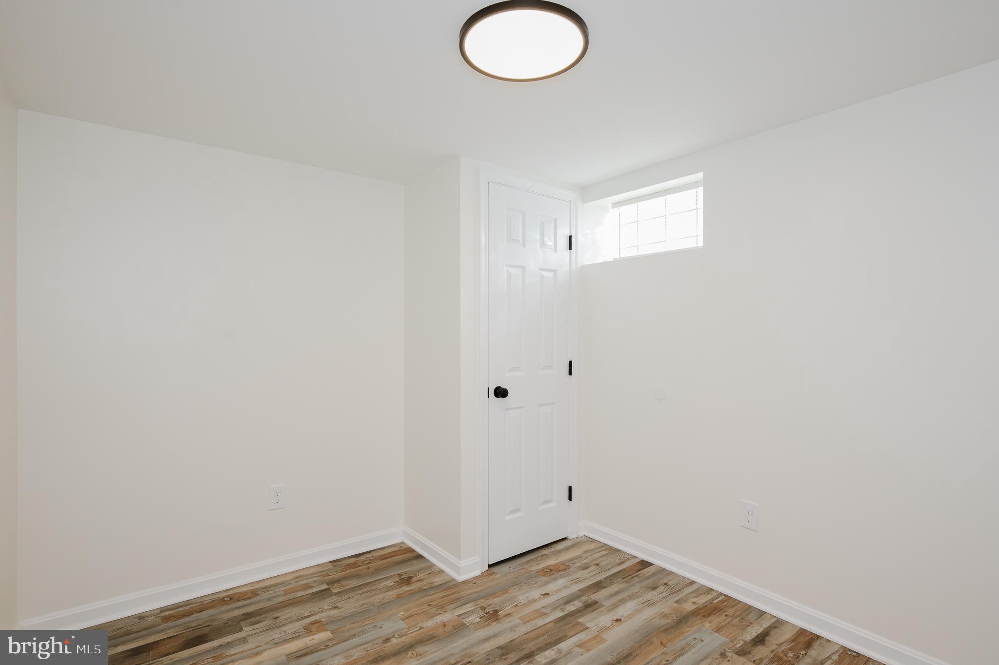 8029 Neighbors Avenue Rosedale, MD 21237 - Photo 37 of 42 LOWER LEVEL BEDROOM FOUR OR OFFICE