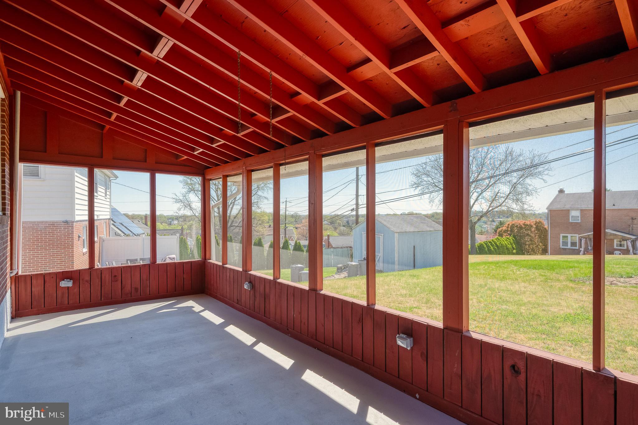 8029 Neighbors Avenue Rosedale, MD 21237 - Photo 6 of 42 SPACIOUS COVERED SCREENED-IN PATIO