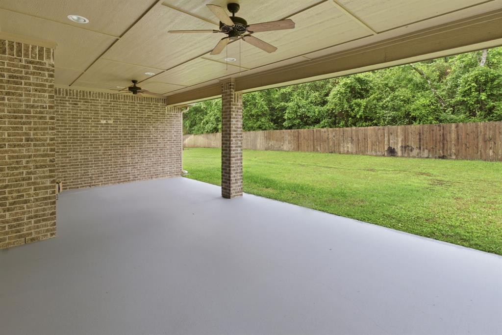 7765 Hickory Spring Lane Tyler, TX 75703 - Photo 34 of 38 Covered patio featuring a painted concrete floor and brick columns