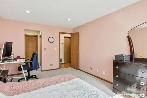 a bathroom with a granite countertop sink a toilet a shower and a mirror