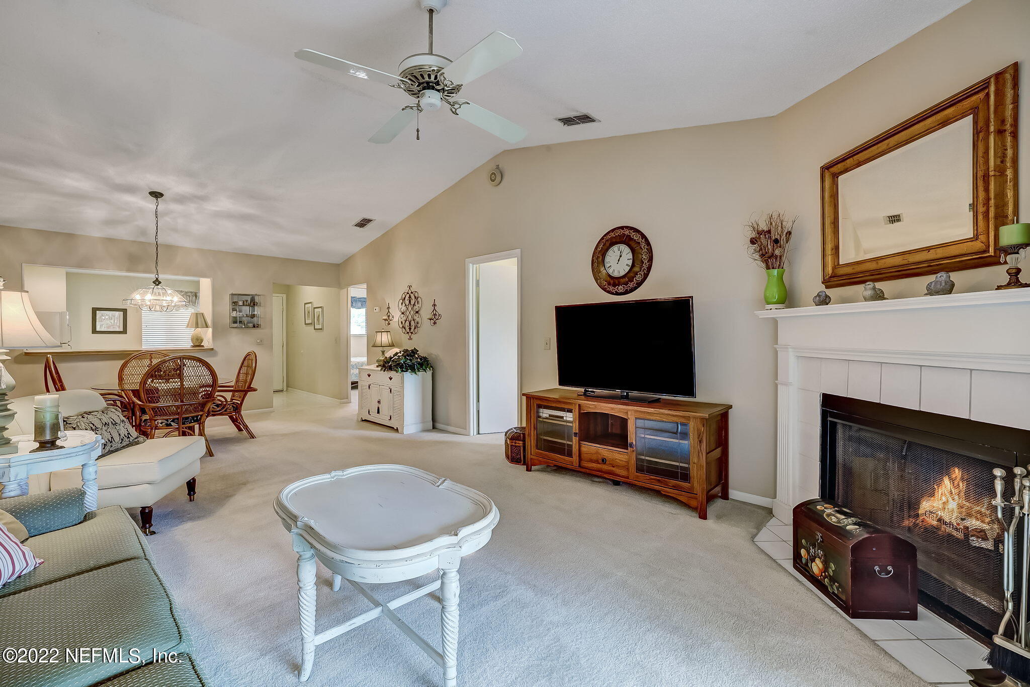 3801 Crown Point Road, Unit 1265 Jacksonville, FL 32257 - Photo 3 of 8 a living room with furniture and a flat screen tv