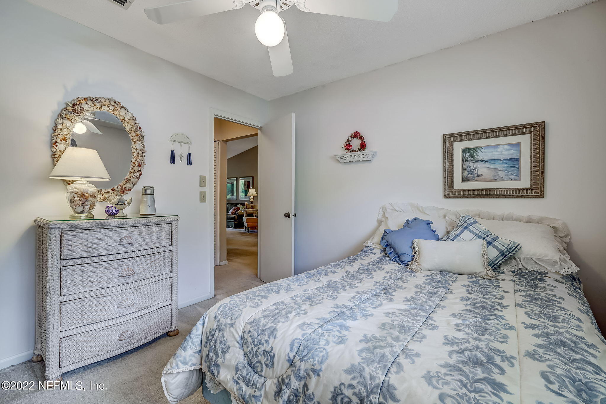 3801 Crown Point Road, Unit 1265 Jacksonville, FL 32257 - Photo 7 of 8 a bedroom with a bed and a chandelier