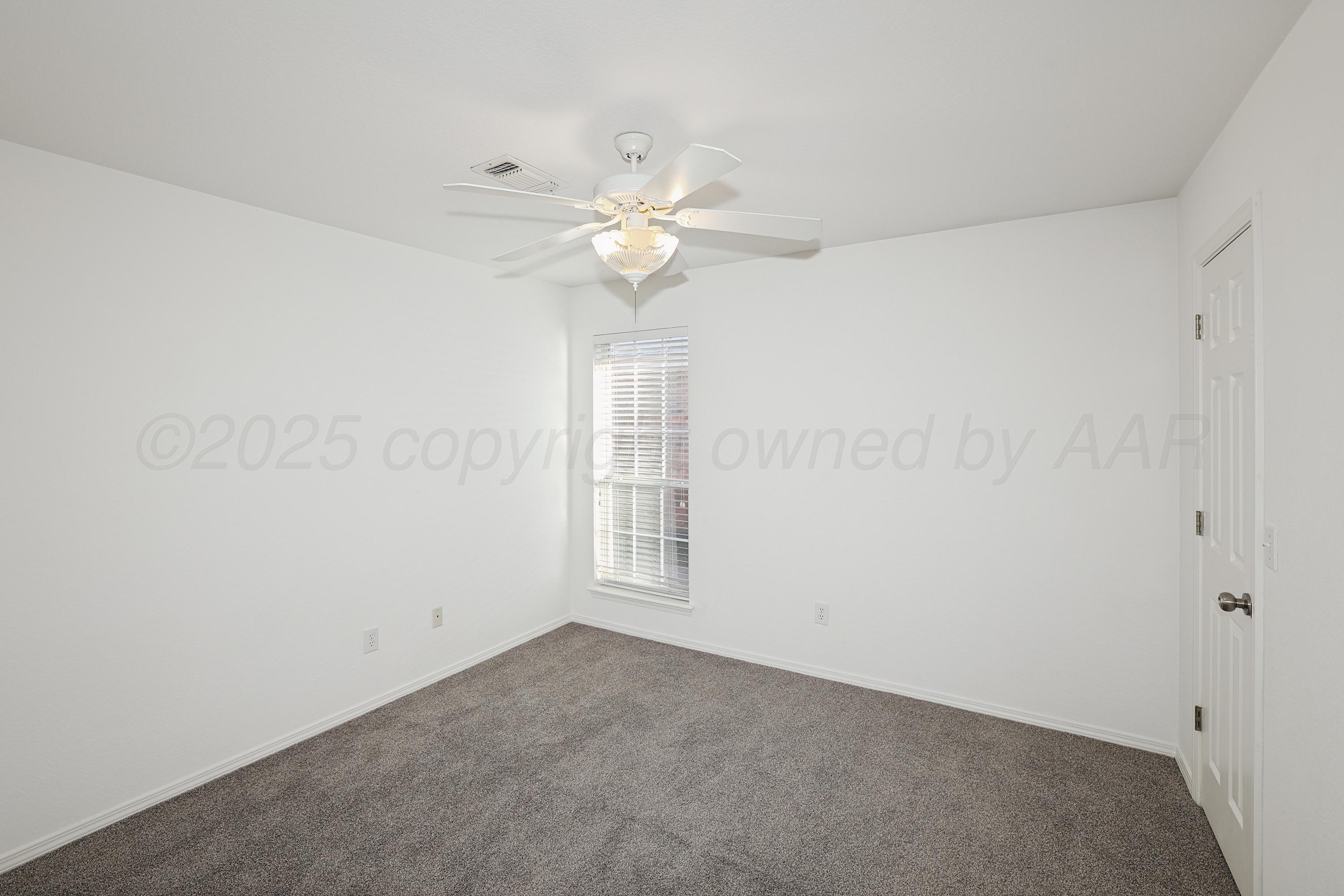6212 Oakcrest Lane Amarillo, TX 79109 - Photo 15 of 33 a view of an empty room with a window