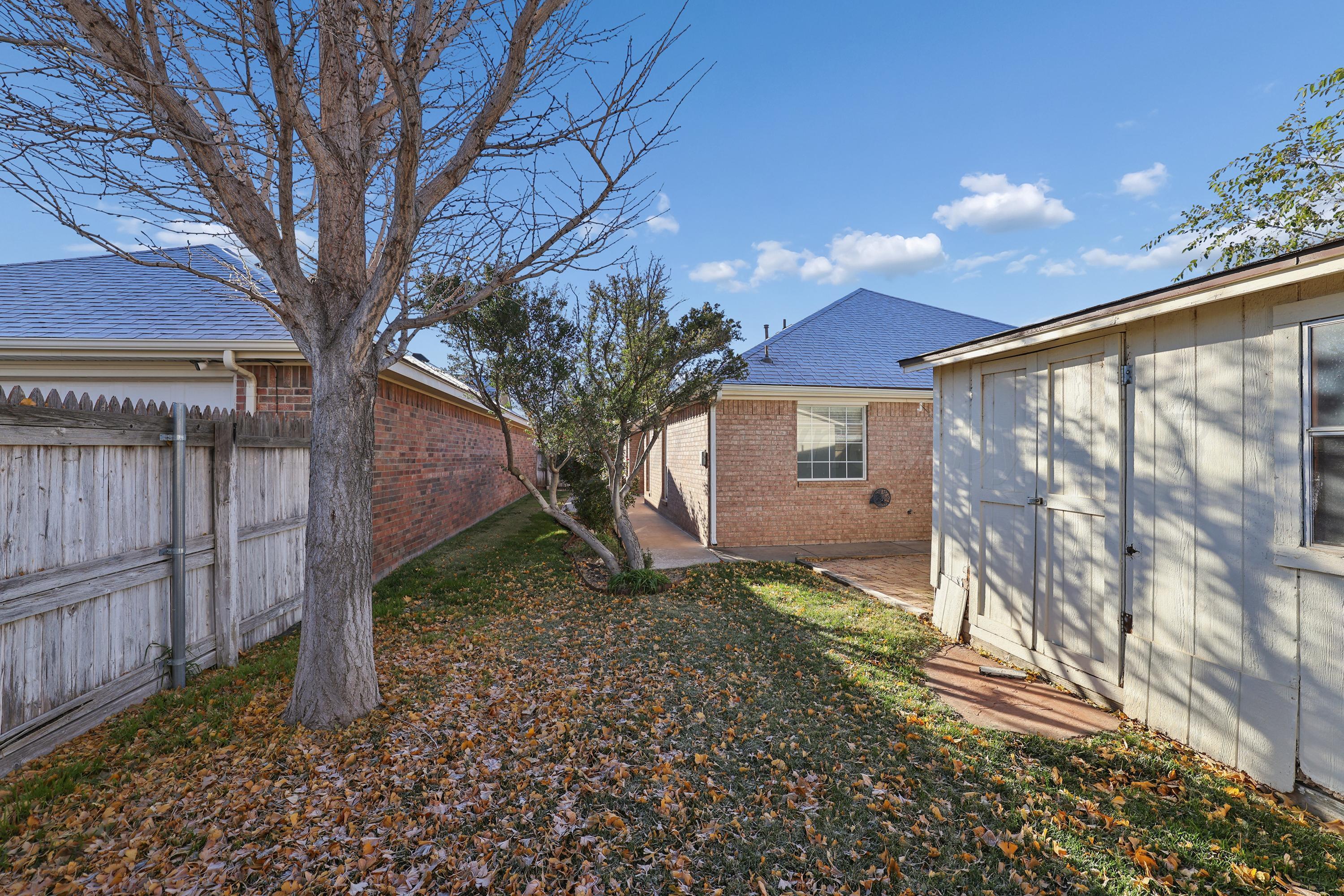 6212 Oakcrest Lane Amarillo, TX 79109 - Photo 25 of 33 a view of a house with a yard