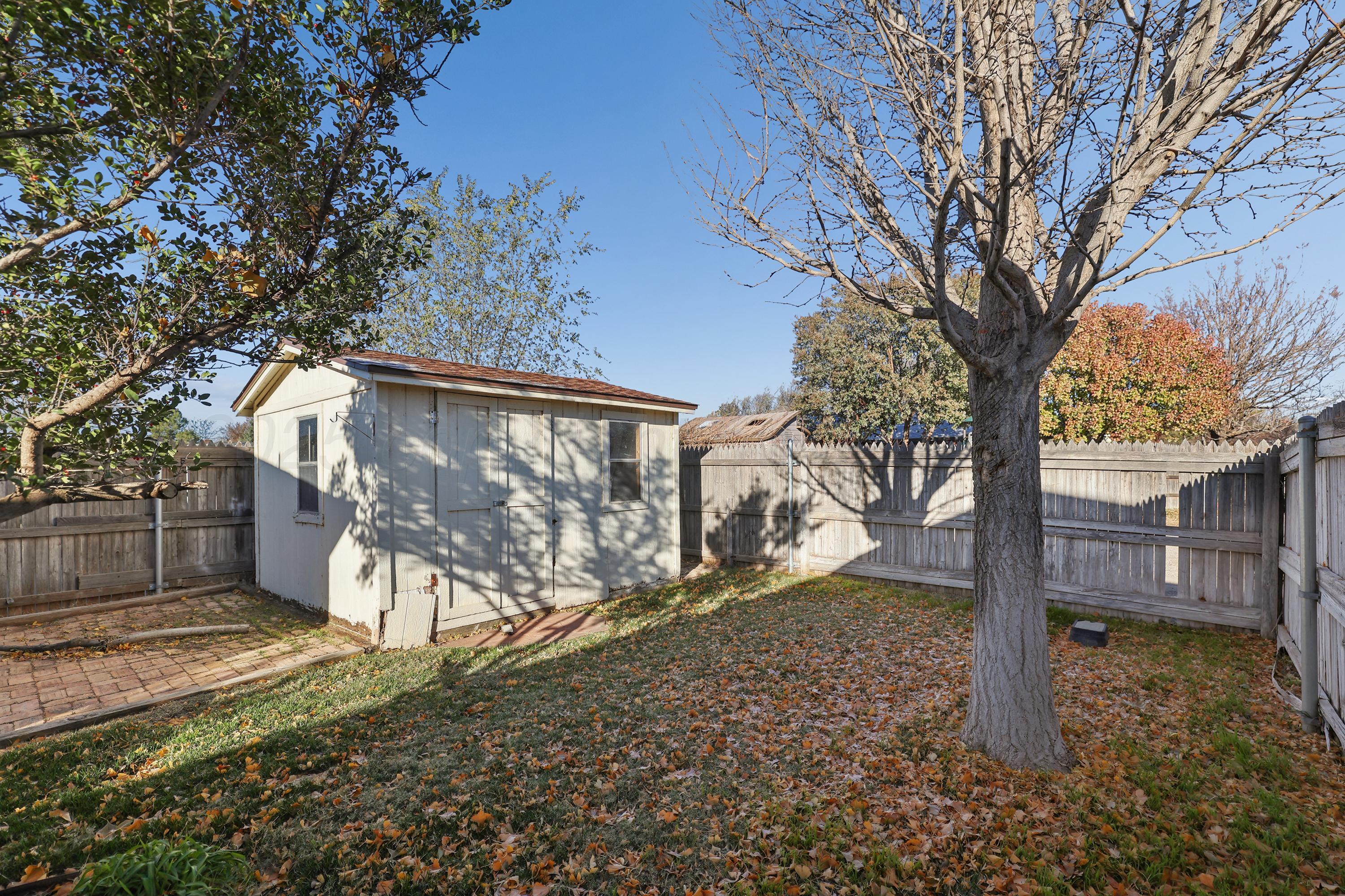 6212 Oakcrest Lane Amarillo, TX 79109 - Photo 26 of 33 a view of a house with a yard