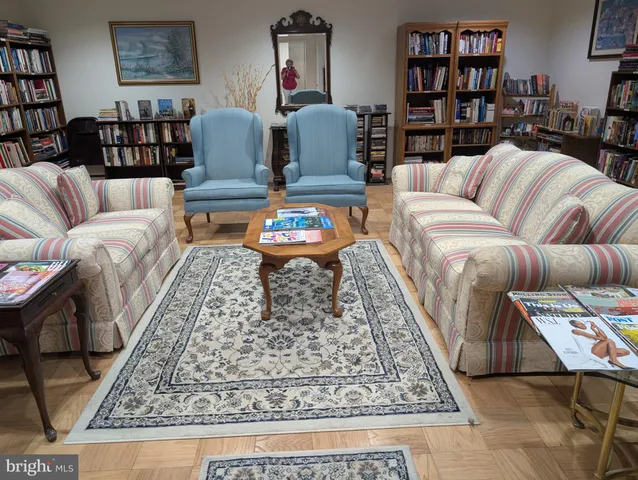 a living room with furniture and a rug