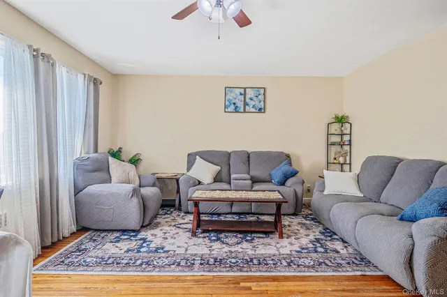 a living room with furniture and a rug