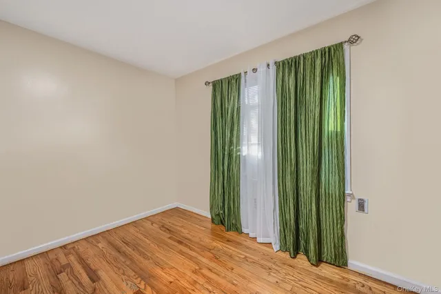an empty room with closet and yard