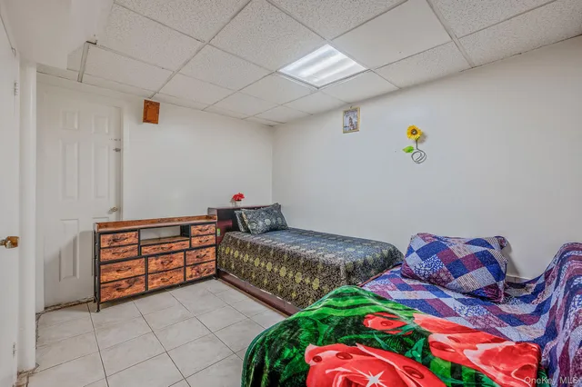 a bedroom with two beds and painted walls