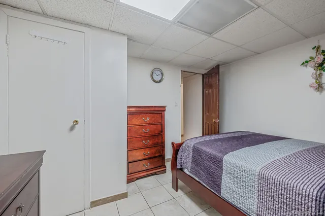 a bedroom with a bed and a closet