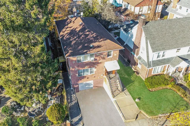 an aerial view of a residential apartment building with a yard