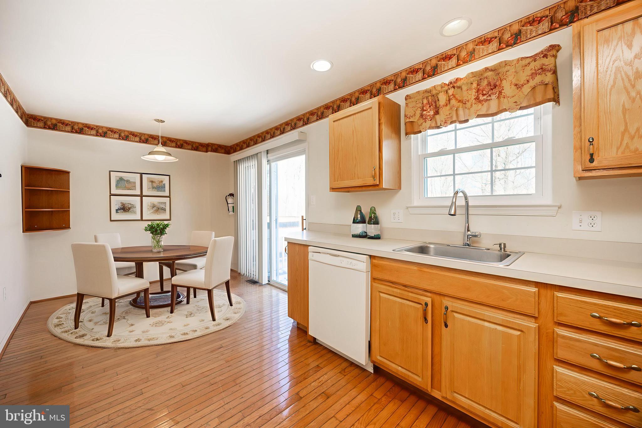 222 Springvalley Way Aston, PA 19014 - Photo 12 of 45 a kitchen with sink cabinets and dining table