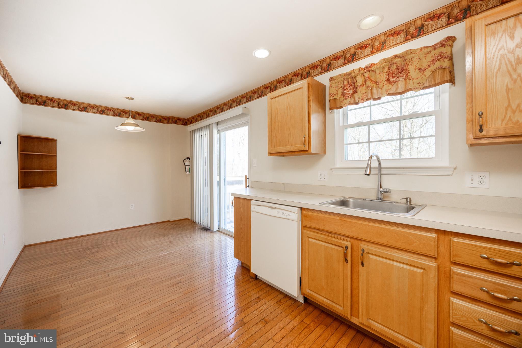 222 Springvalley Way Aston, PA 19014 - Photo 13 of 45 a kitchen with sink cabinets and window