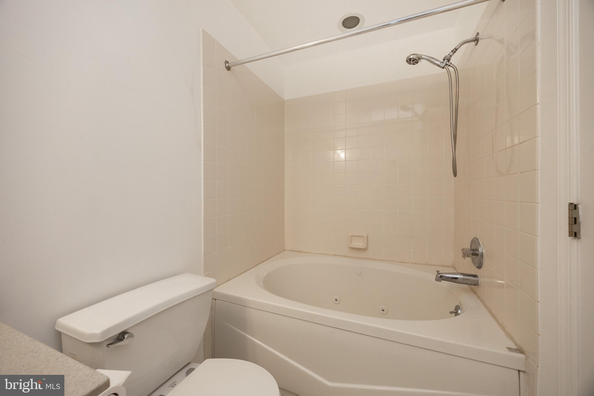 222 Springvalley Way Aston, PA 19014 - Photo 20 of 45 a white bath tub sitting next to a white toilet