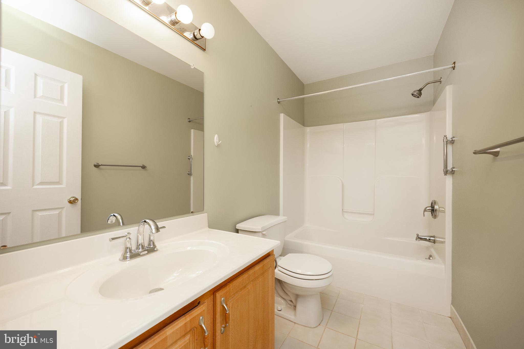 222 Springvalley Way Aston, PA 19014 - Photo 22 of 45 a bathroom with a sink a toilet and shower
