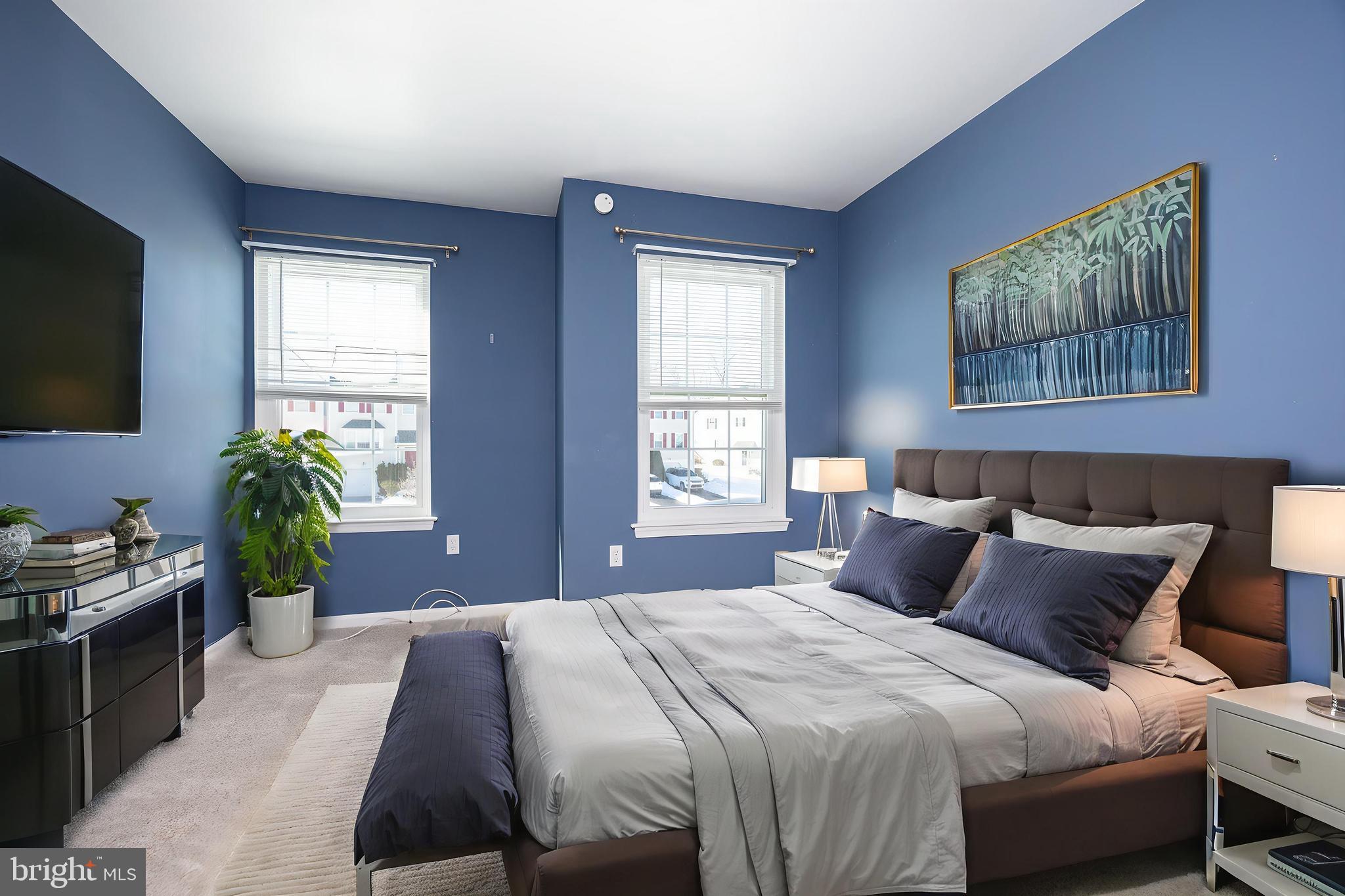 222 Springvalley Way Aston, PA 19014 - Photo 23 of 45 a bedroom with a bed and a flat screen tv