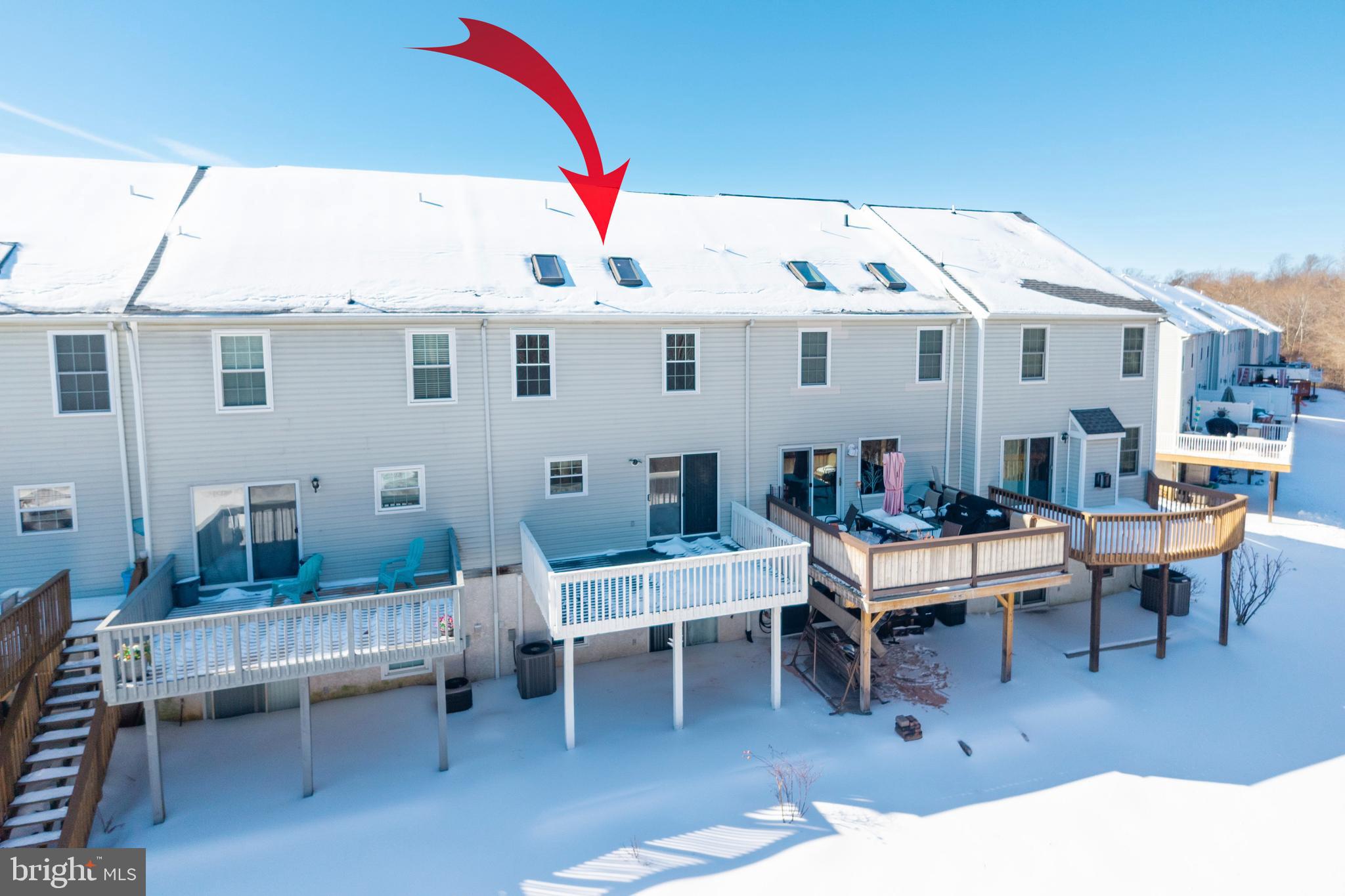 222 Springvalley Way Aston, PA 19014 - Photo 40 of 45 a view of a patio with table and chairs with wooden floor and fence