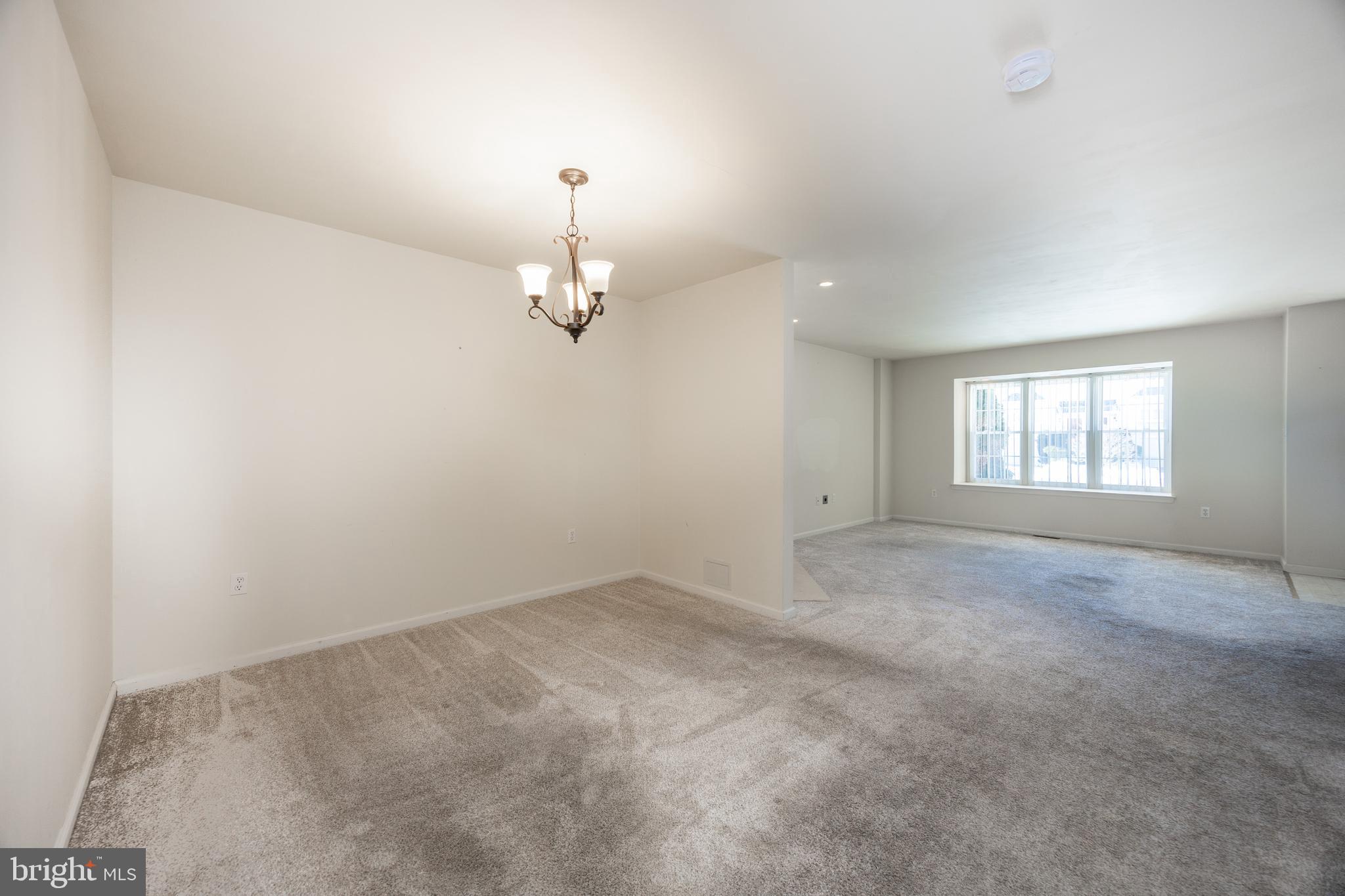 222 Springvalley Way Aston, PA 19014 - Photo 8 of 45 a view of empty room with windows