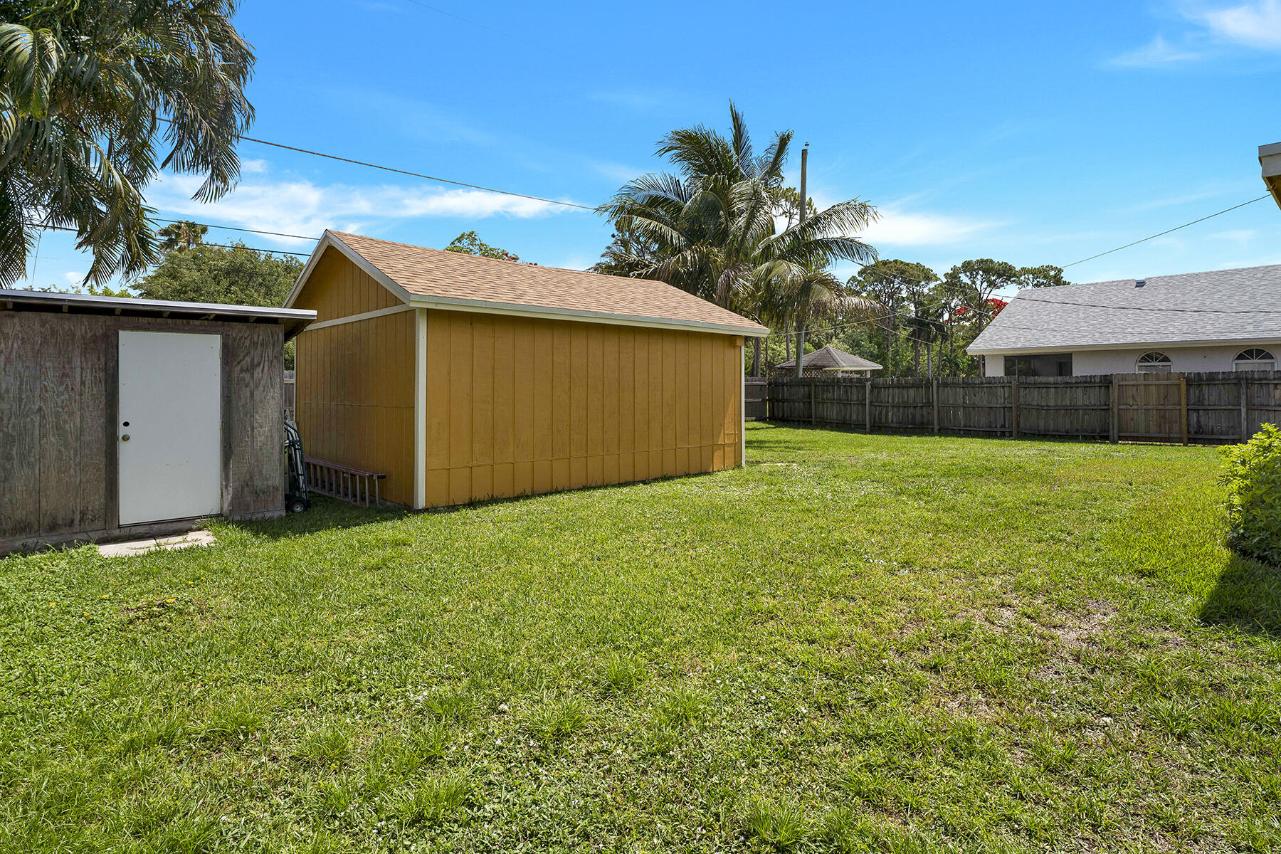 5385 Adams Road Delray Beach, FL 33484 - Photo 37 of 46 a view of a backyard with a garden