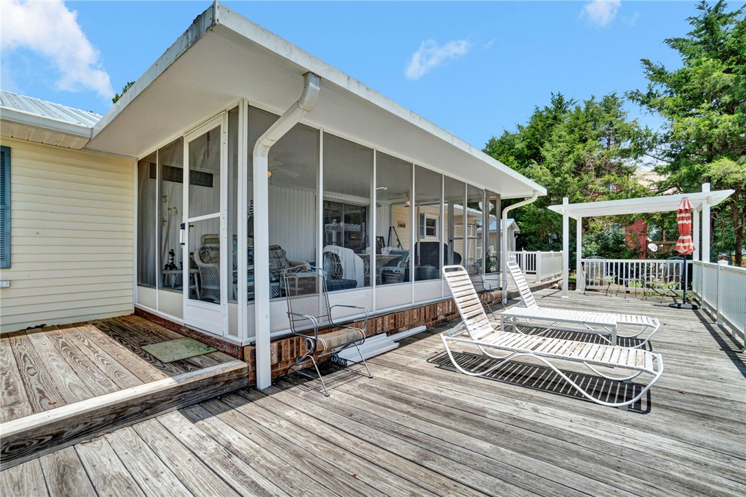 225 Nicholson Cove Road Seneca, SC 29672 - Photo 21 of 22 Unwind on the spacious outdoor deck, offering an ideal setting for relaxation or entertaining.