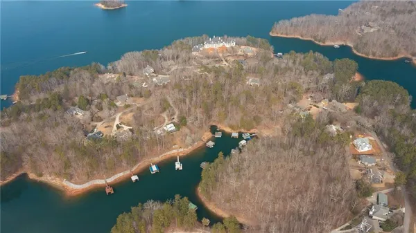 a close up of a vase of flower sitting on a table
