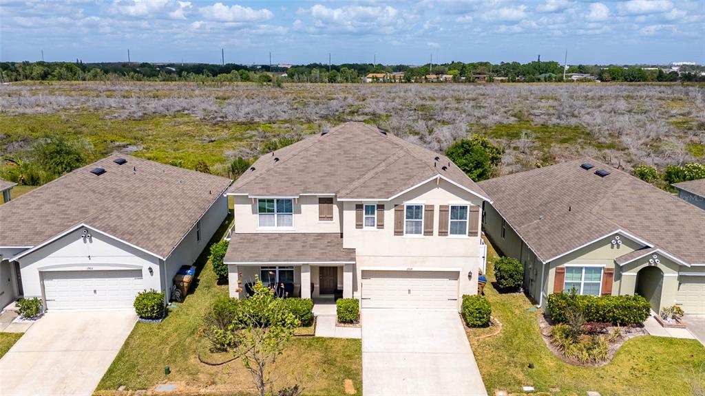 1907 Partin Terrace Road Kissimmee, FL 34744 - Photo 1 of 1 an aerial view of a house with a lake view