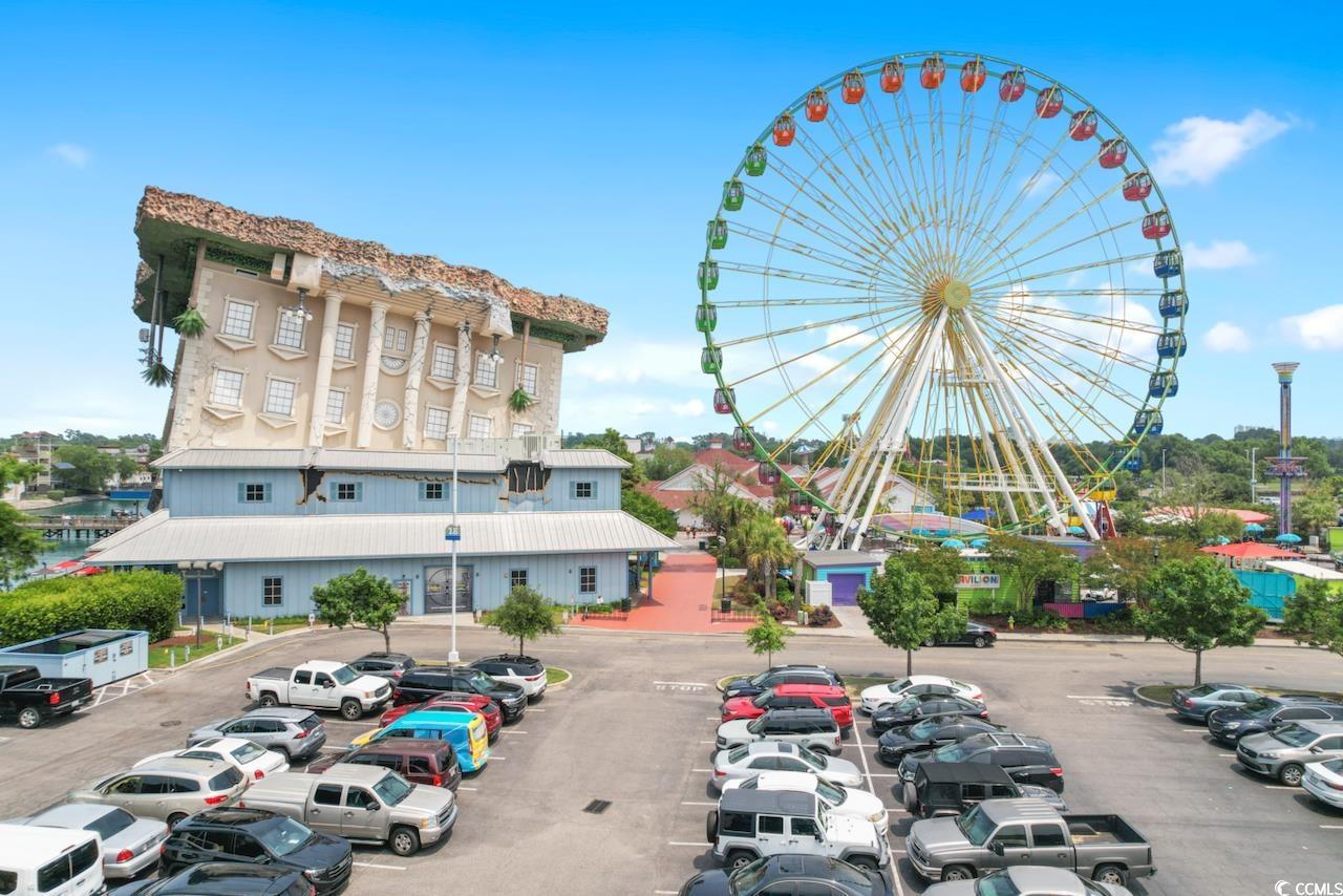 2300 North Ocean Boulevard, Unit 830 Myrtle Beach, SC 29577 - Photo 26 of 33 View of property featuring uncovered parking