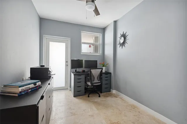 a view of a workspace with furniture