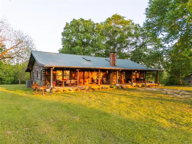 a view of a swimming pool with an outdoor space and seating area