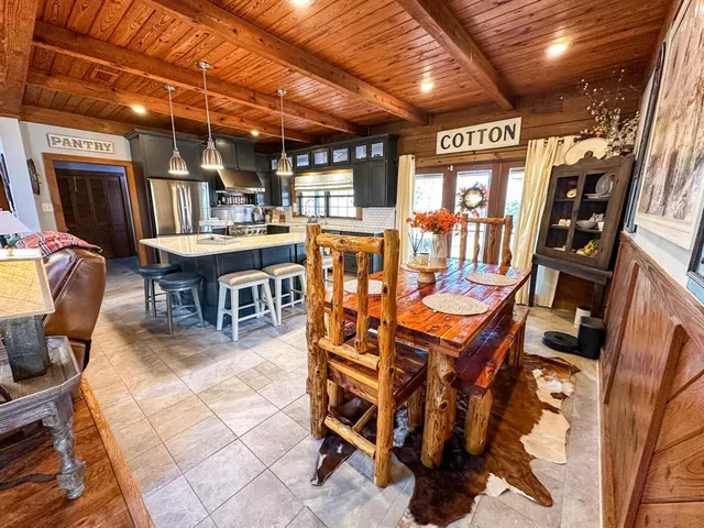 a view of a chairs and table in a patio