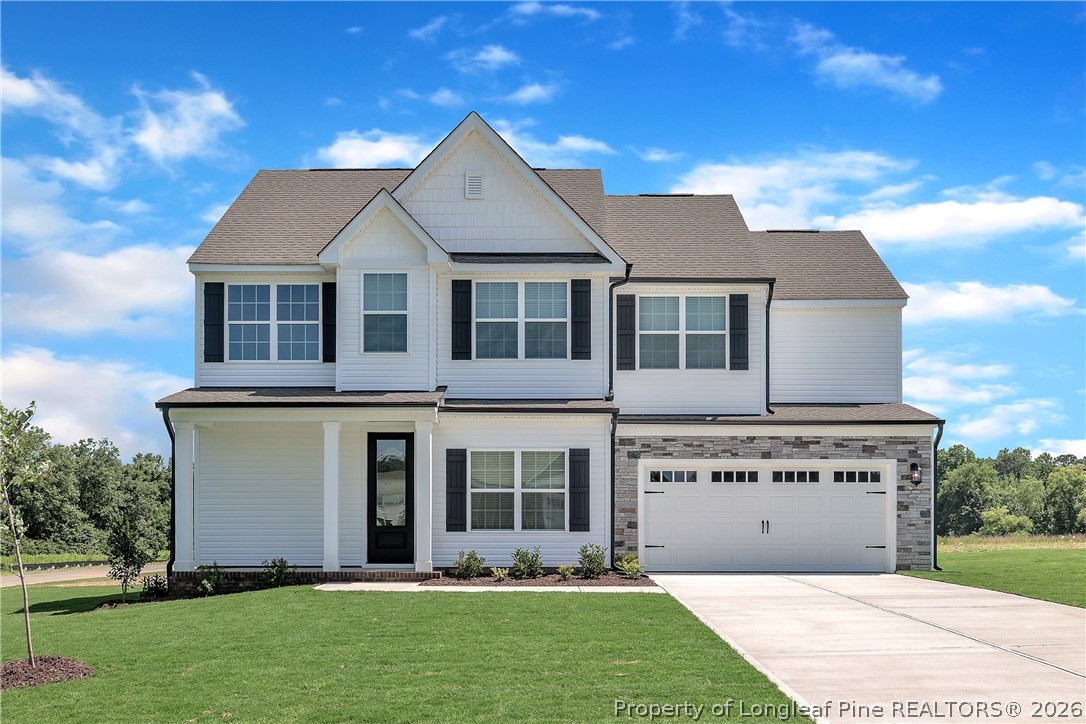 front view of a house with a yard