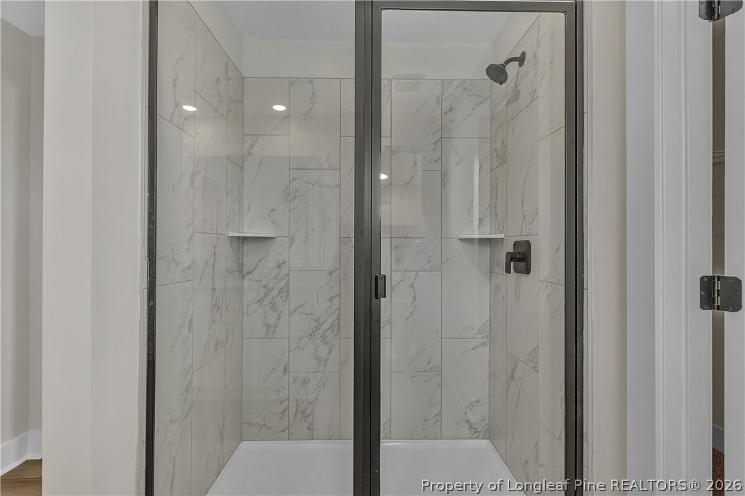 85 Camp Rock Road Lillington, NC 27546 - Photo 15 of 20 a bathroom with a shower