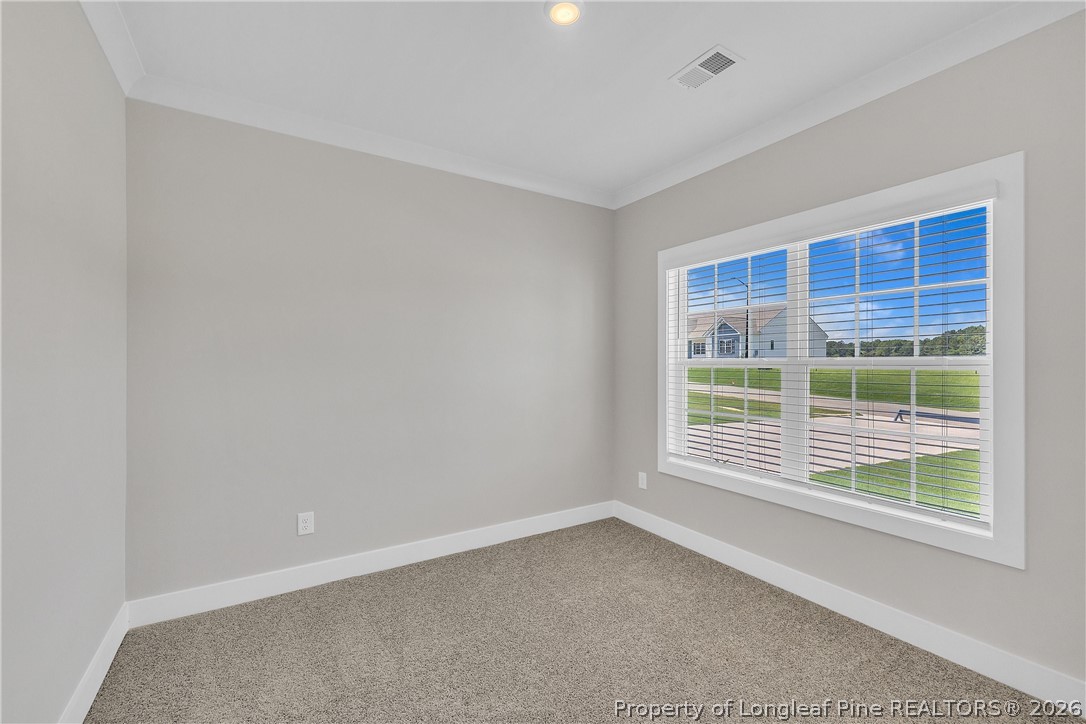 85 Camp Rock Road Lillington, NC 27546 - Photo 19 of 20 a view of an empty room with a window